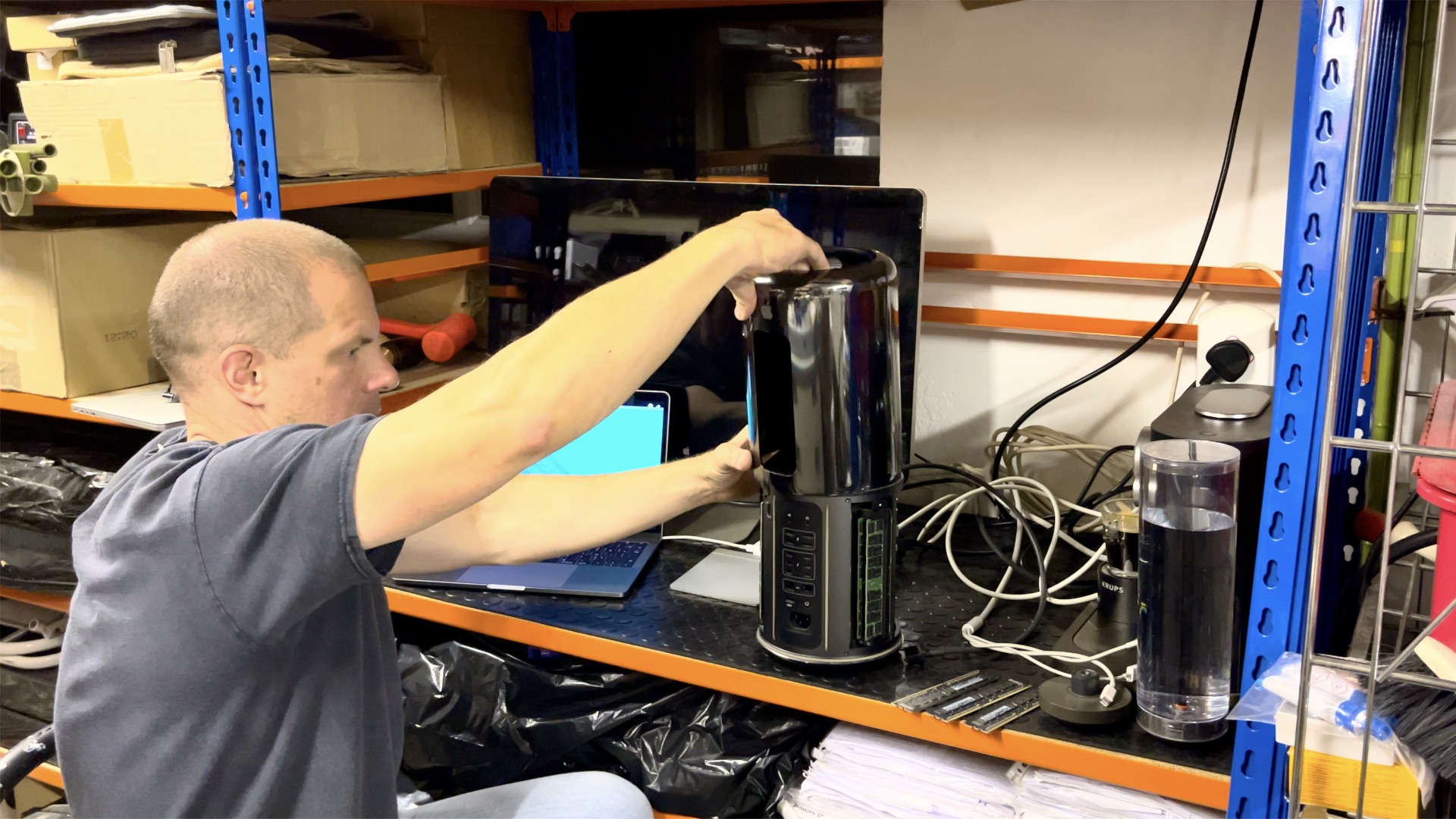 Close-up of the Mac Pro 2013 with its sleek cylindrical design.