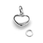 Professionally cleaned but not fully polished silver heart charm