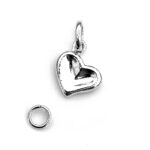 Charm from 2011, silver heart angled with polished finish.