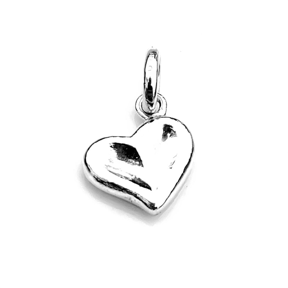 Vintage heart charm with attached split ring for easy wear.