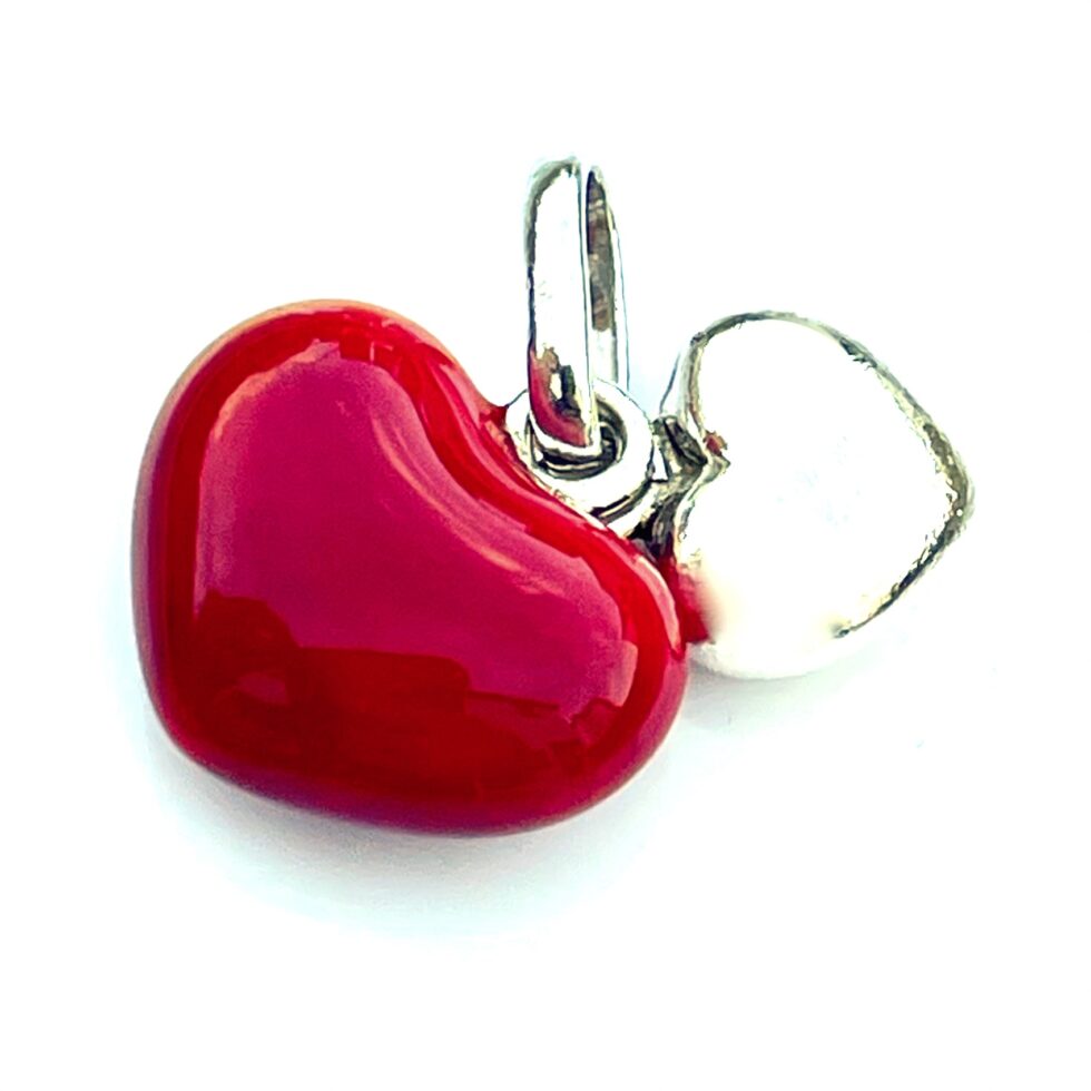 The Two Hearts Charm displayed in a jewelry box for gifting.