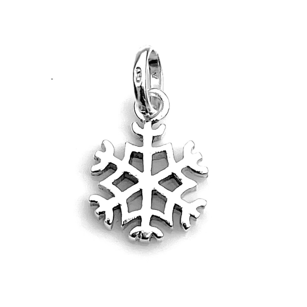 Polished sterling silver Snowflake charm under lighting