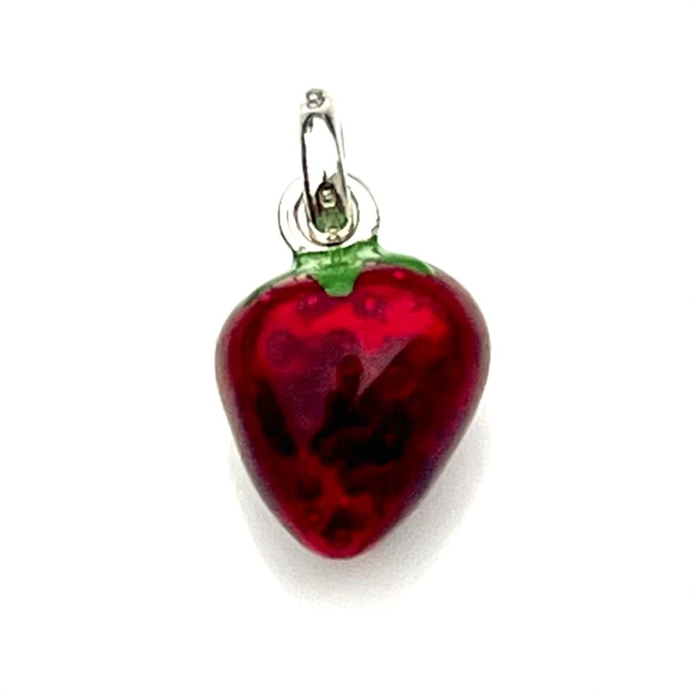 Side view of the strawberry charm showing enamel details