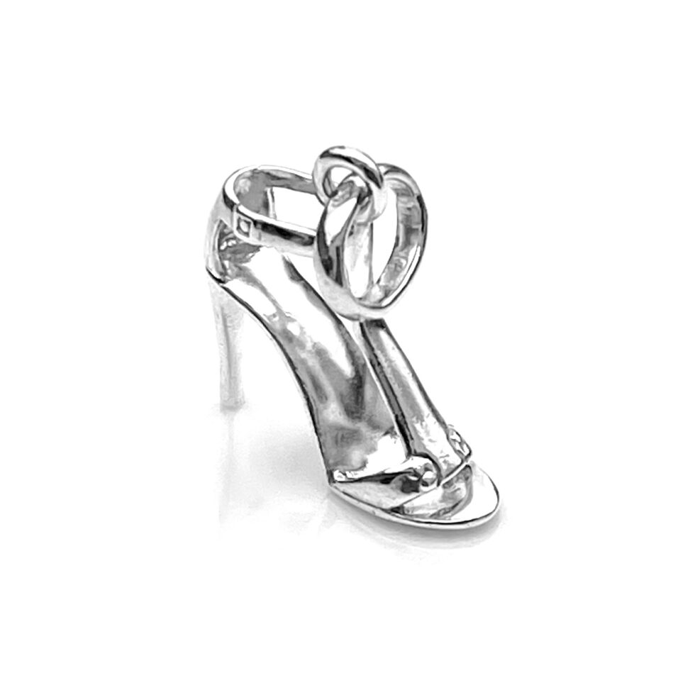 Close-up of the sterling silver T-strap charm in bright lighting