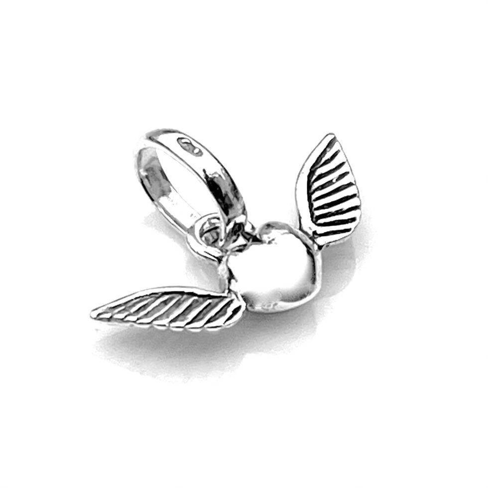 Side view showcasing the winged heart design on the charm