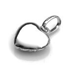 Artistic shot of the Yummy Mummy charm against a minimalist backdrop
