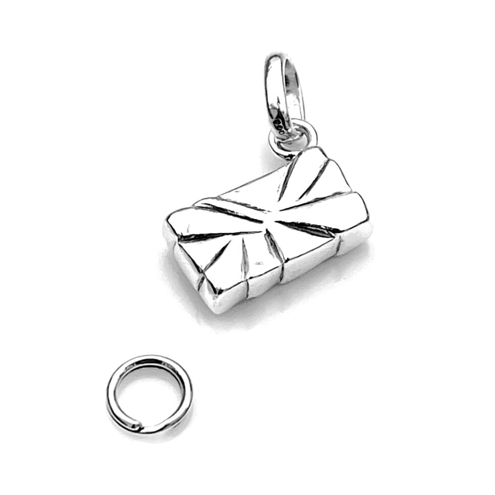 Polished sterling silver Gift Box charm under lighting