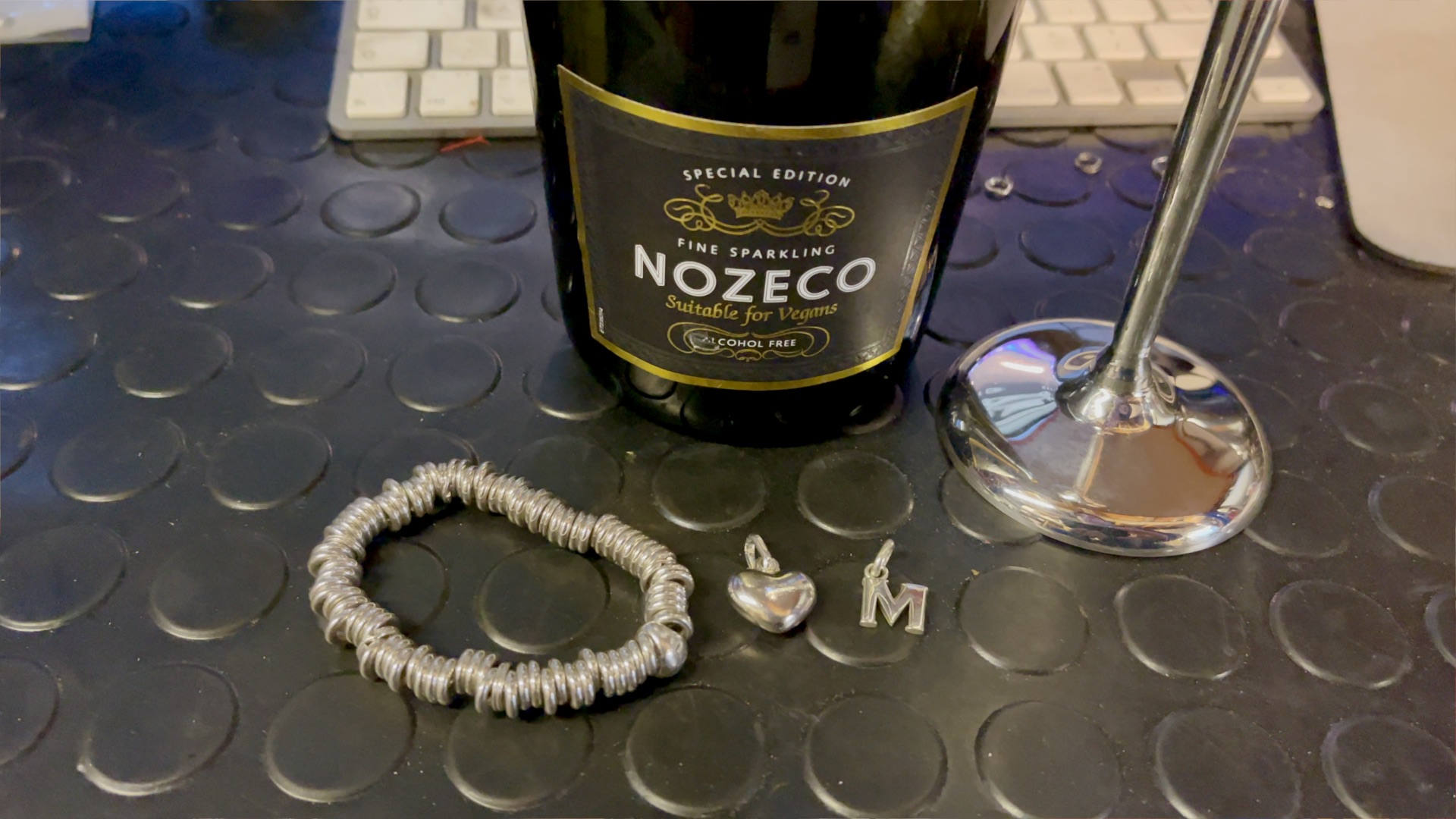 Close-up of champagne glasses and party hats at Links London headquarters.