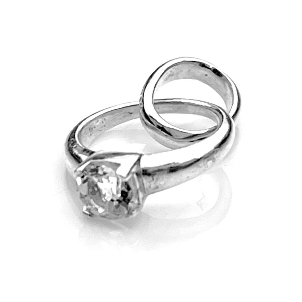 Close-up of the 4mm claw-set white topaz centerpiece.