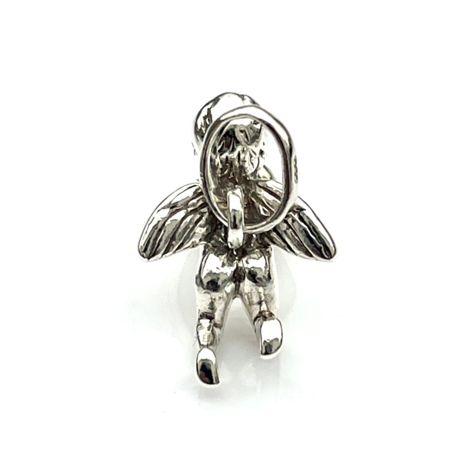 Detailed view of the cherub charm from an angled top view