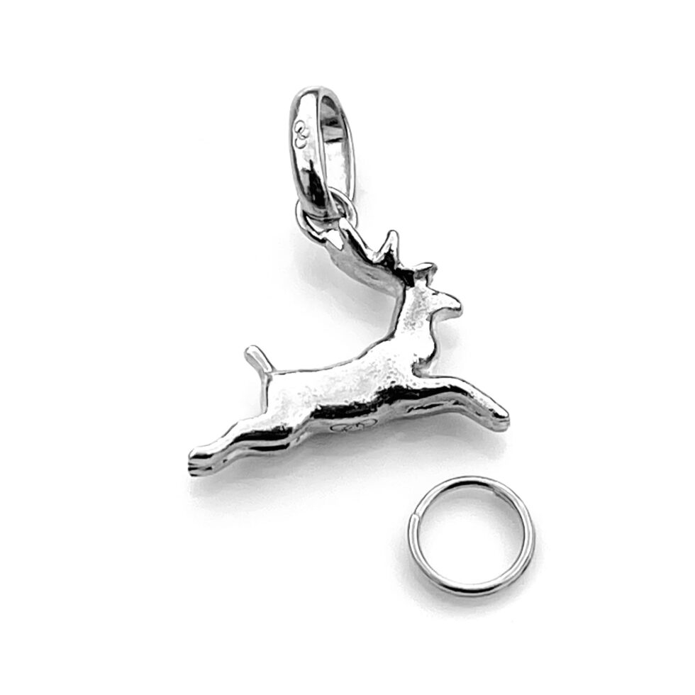 Detailed shot of sterling silver Leaping Reindeer charm with 7mm split ring