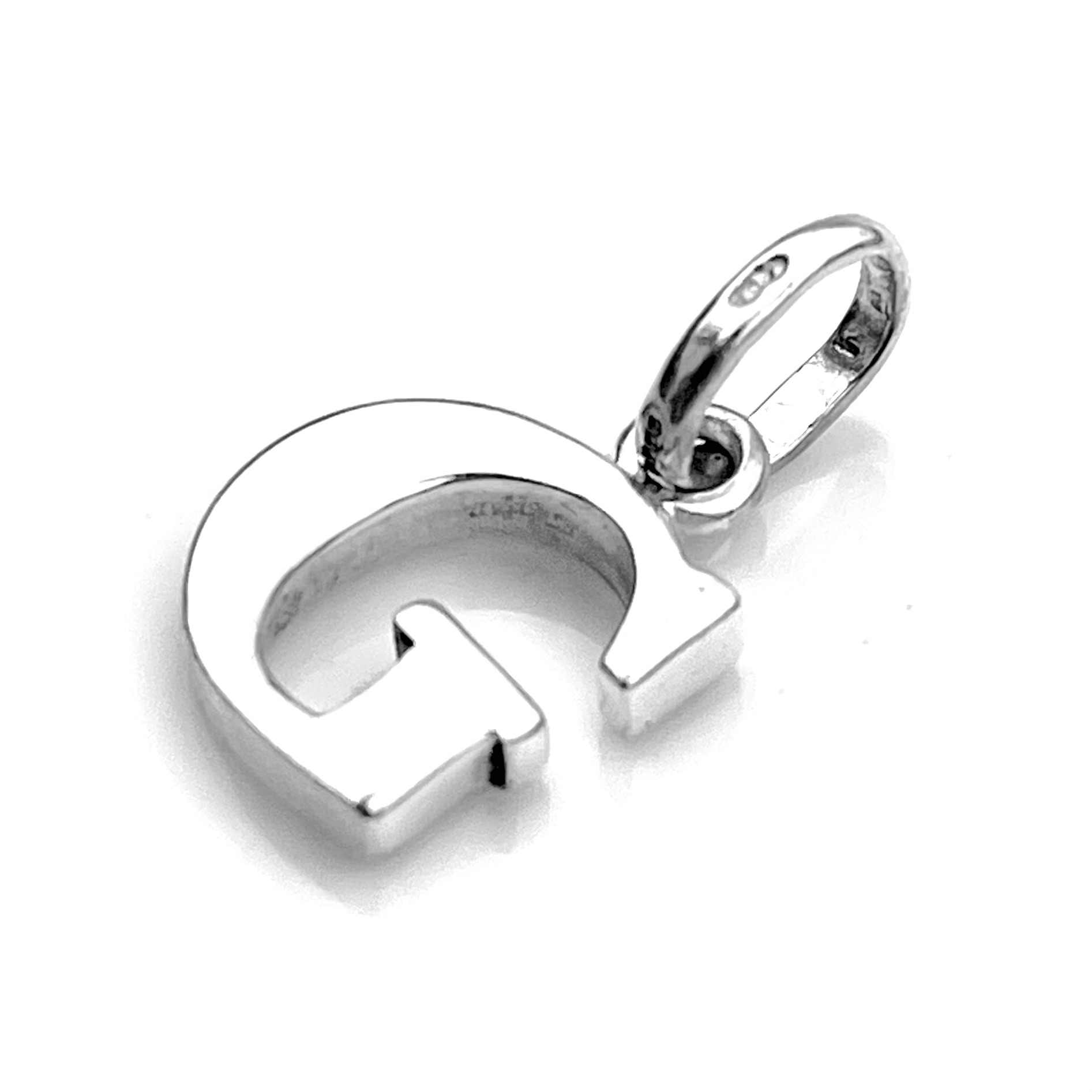 Close-up of 'G' Charm showing polished sterling silver finish