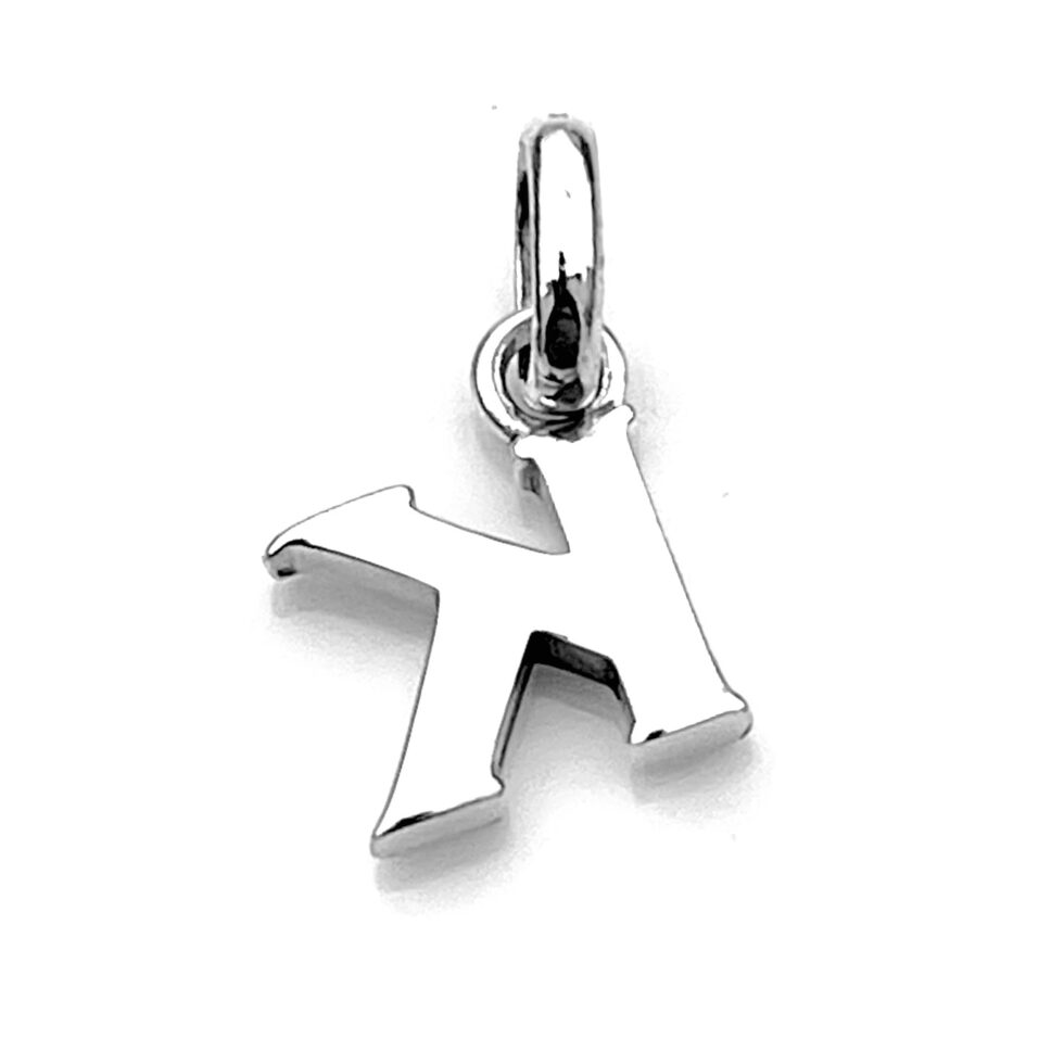 Vintage Letter K charm ready to be worn as a pendant on a necklace