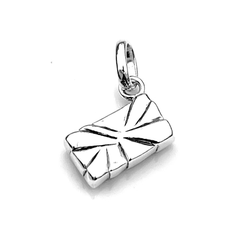 Detailed shot of the Gift Box charm from an angled top view