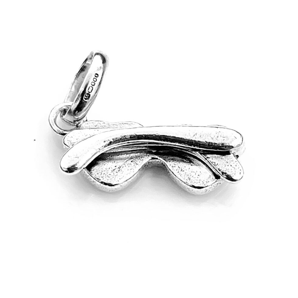 Top view of the charm highlighting the playful heart-shaped design