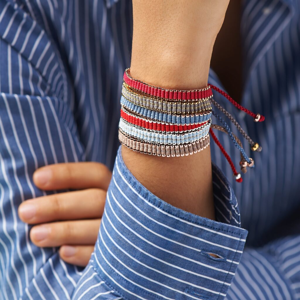 Collection of colourful Links of London Friendship Bracelets displayed together