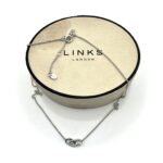 Professionally polished Links of London Signature Mini Necklace on display