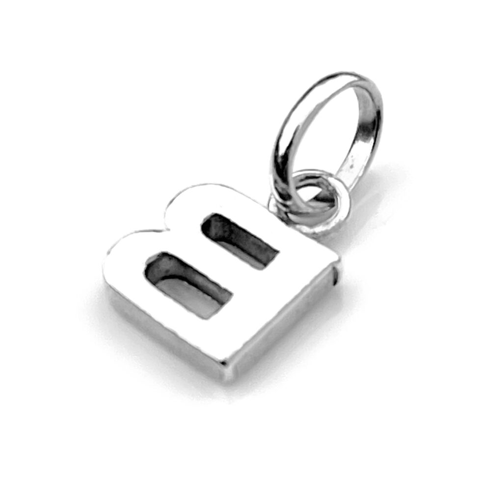 Professionally cleaned letter B charm showing vintage wear marks