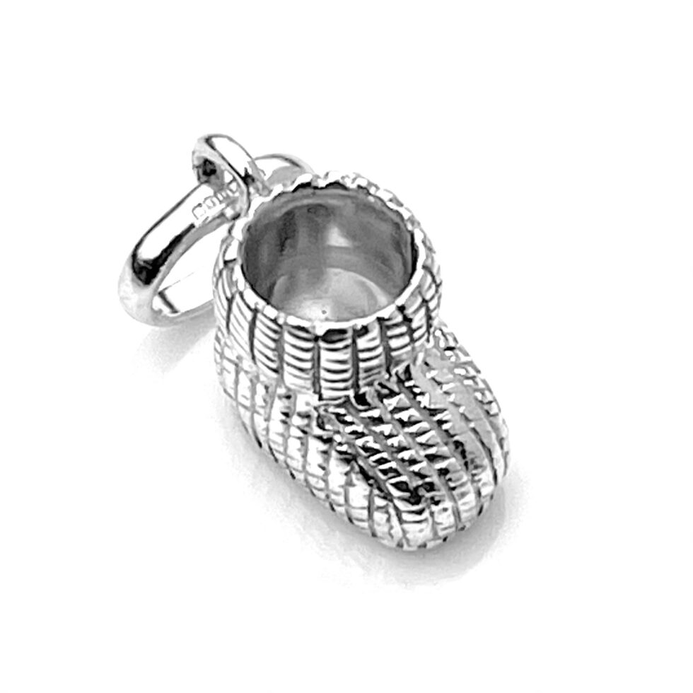 showcasing the detailed knitted pattern on the baby bootie charm.