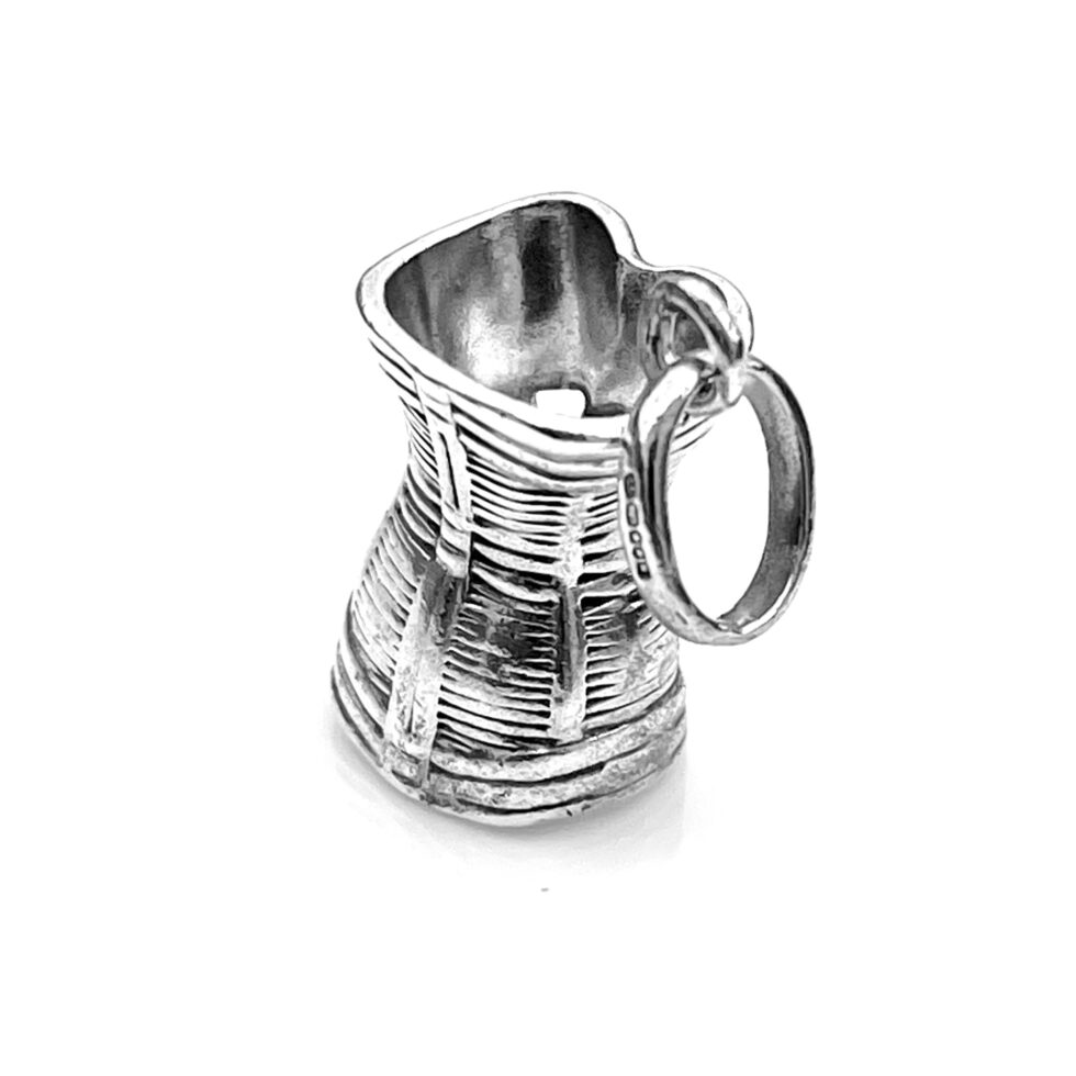 Professionally cleaned Corset Charm showing its bright silver finish.