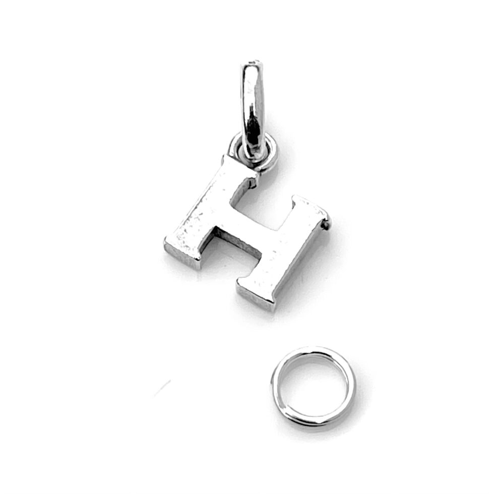 Close-up of the oval bail and split ring on the 'H' Charm.