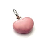 Side view of the charm, showcasing its rose pink enamel finish.