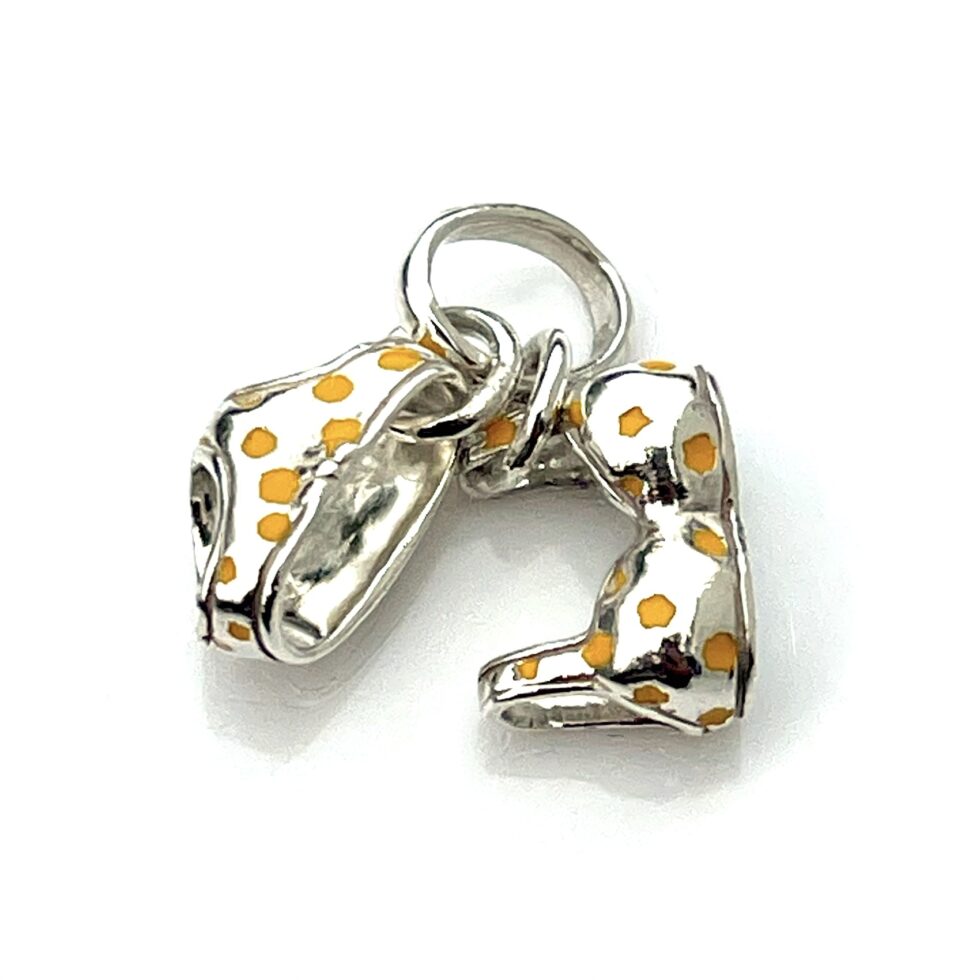 Close-up of the enamel polka dots with minor vintage wear.