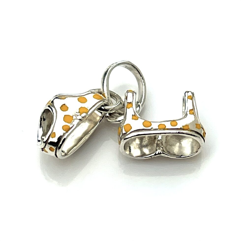 Close-up of the professionally cleaned sterling silver finish on the charm