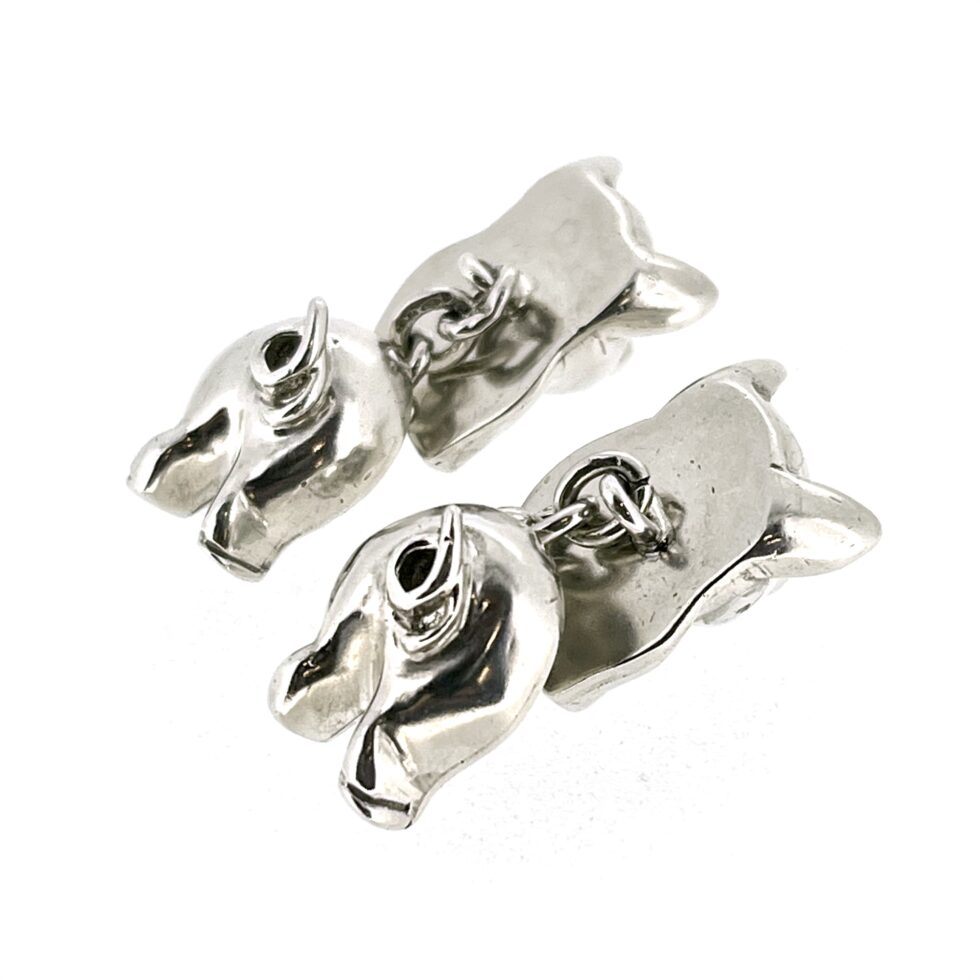 tail view of the 1994 Links of London Pig Cufflinks showing the polished front and back pig sections.