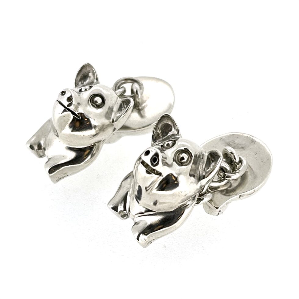 side view of the 1994 Links of London Pig Cufflinks showing the polished front and back pig sections.