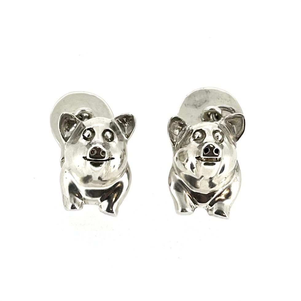 1994 Links of London Pig Cufflinks showing the polished front and back pig sections.