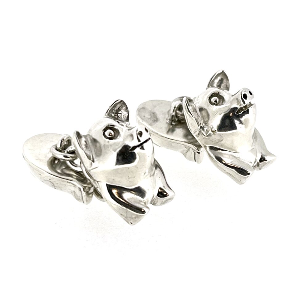 Close-up of the 1994 Links of London Pig Cufflinks showing the polished front and back pig sections.