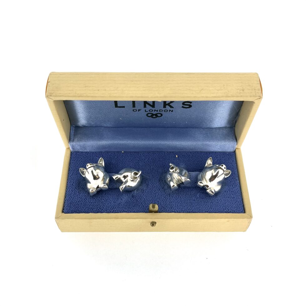 box of the 1994 Links of London Pig Cufflinks showing the polished front and back pig sections.