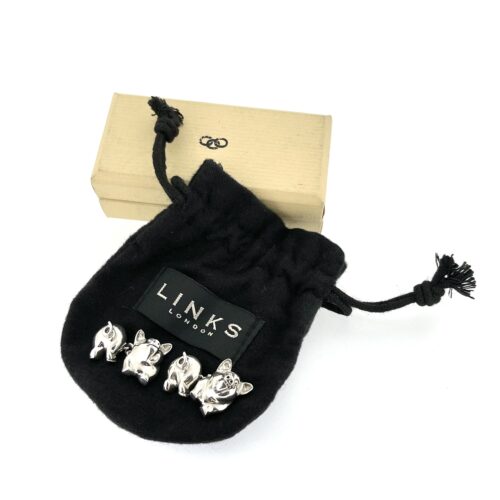 packaging of the 1994 Links of London Pig Cufflinks showing the polished front and back pig sections.