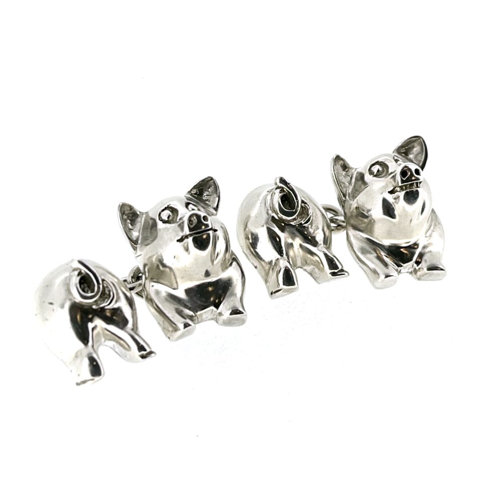 sides of the 1994 Links of London Pig Cufflinks showing the polished front and back pig sections.
