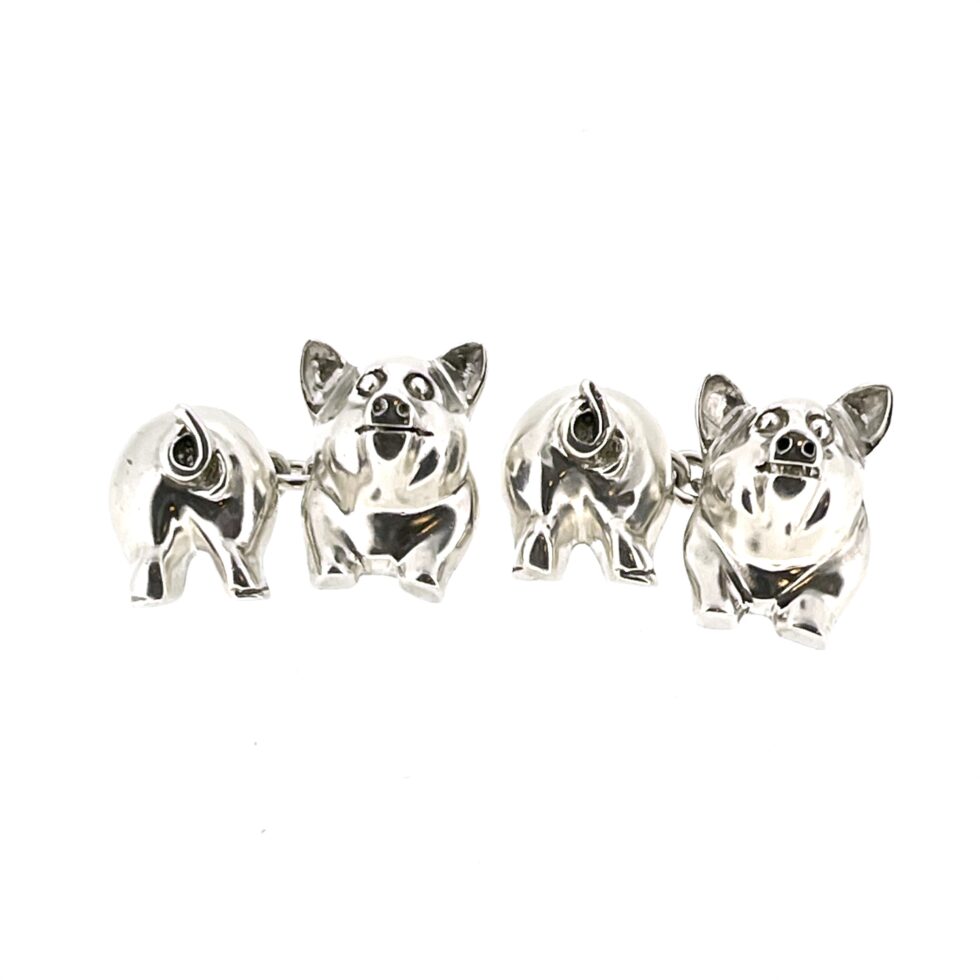 Close-up of the 1994 Links of London Pig Cufflinks showing the polished front and back pig sections.