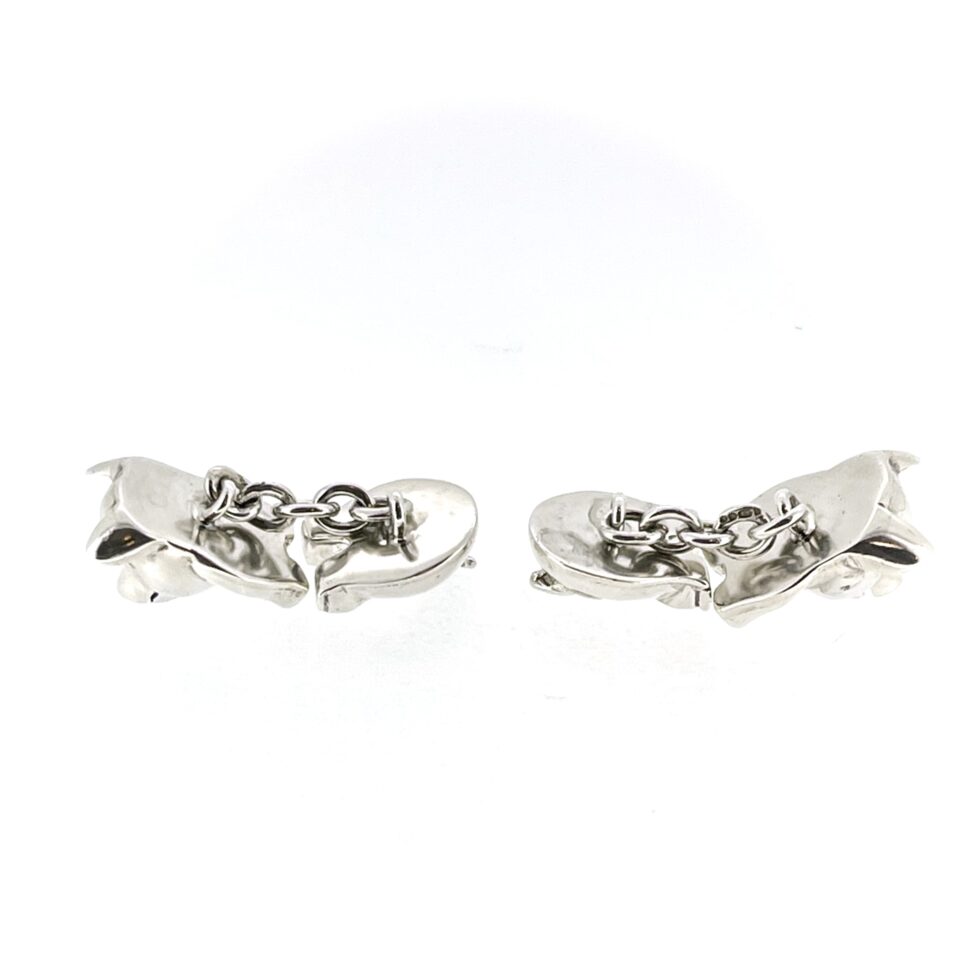 chains of the 1994 Links of London Pig Cufflinks showing the polished front and back pig sections.