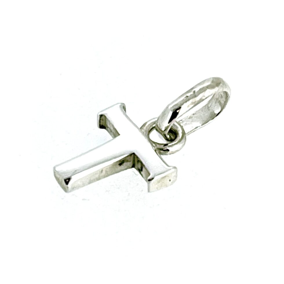 Angled view highlighting the bright and polished finish of the charm.