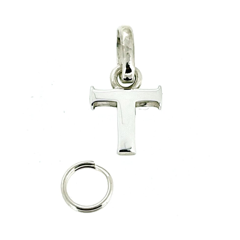 Top view showing the charm’s oval loop/bail attachment.