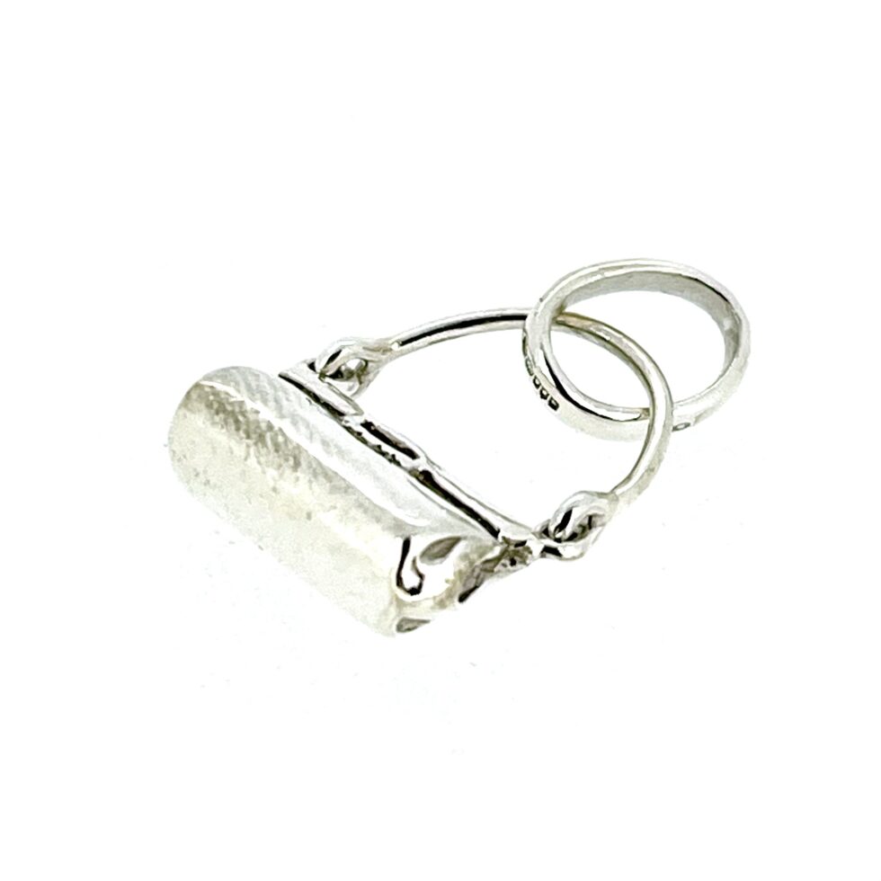 side view of vintage 2009 Links of London handbag charm.