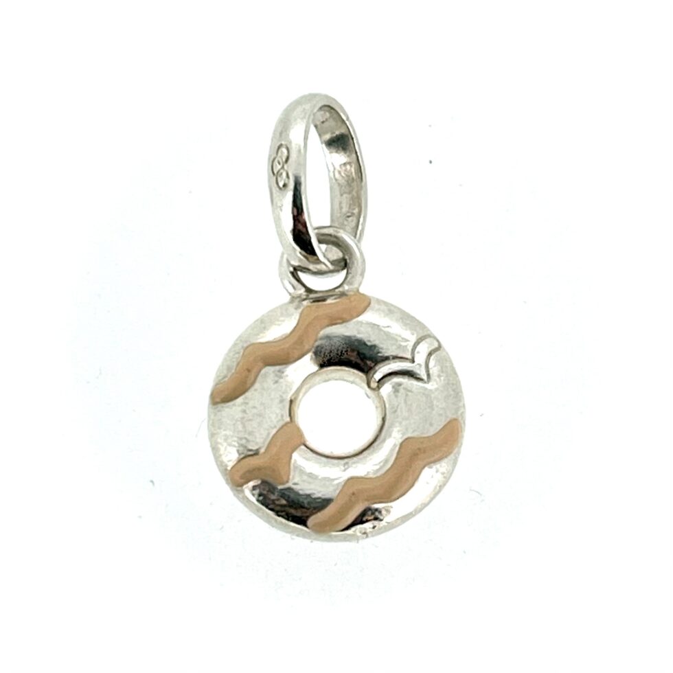Minimalist shot of the charm on a white background.