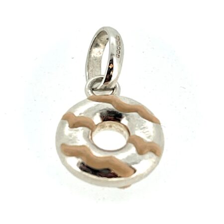 Side view of the charm showcasing the pink enamel drizzle detailing.