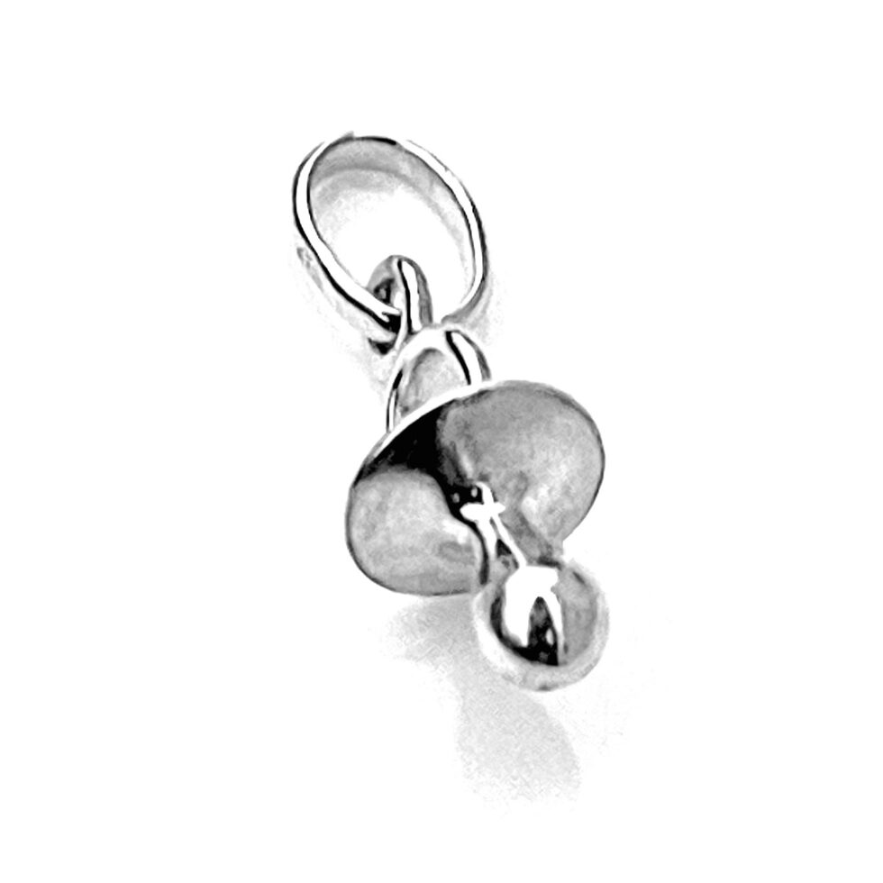 Close-up of the charm’s polished surface in natural light.