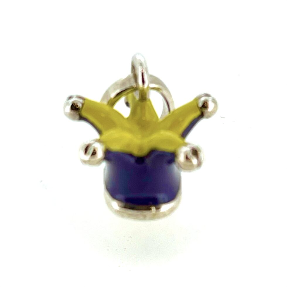 The charm photographed in natural light to show the polished finish.