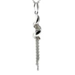 Detailed view of the pendant’s spiral design and chain drops.