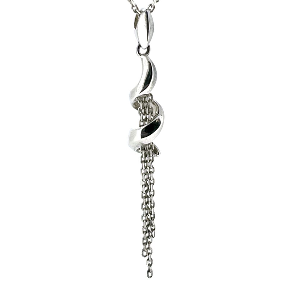 Detailed view of the pendant’s spiral design and chain drops.