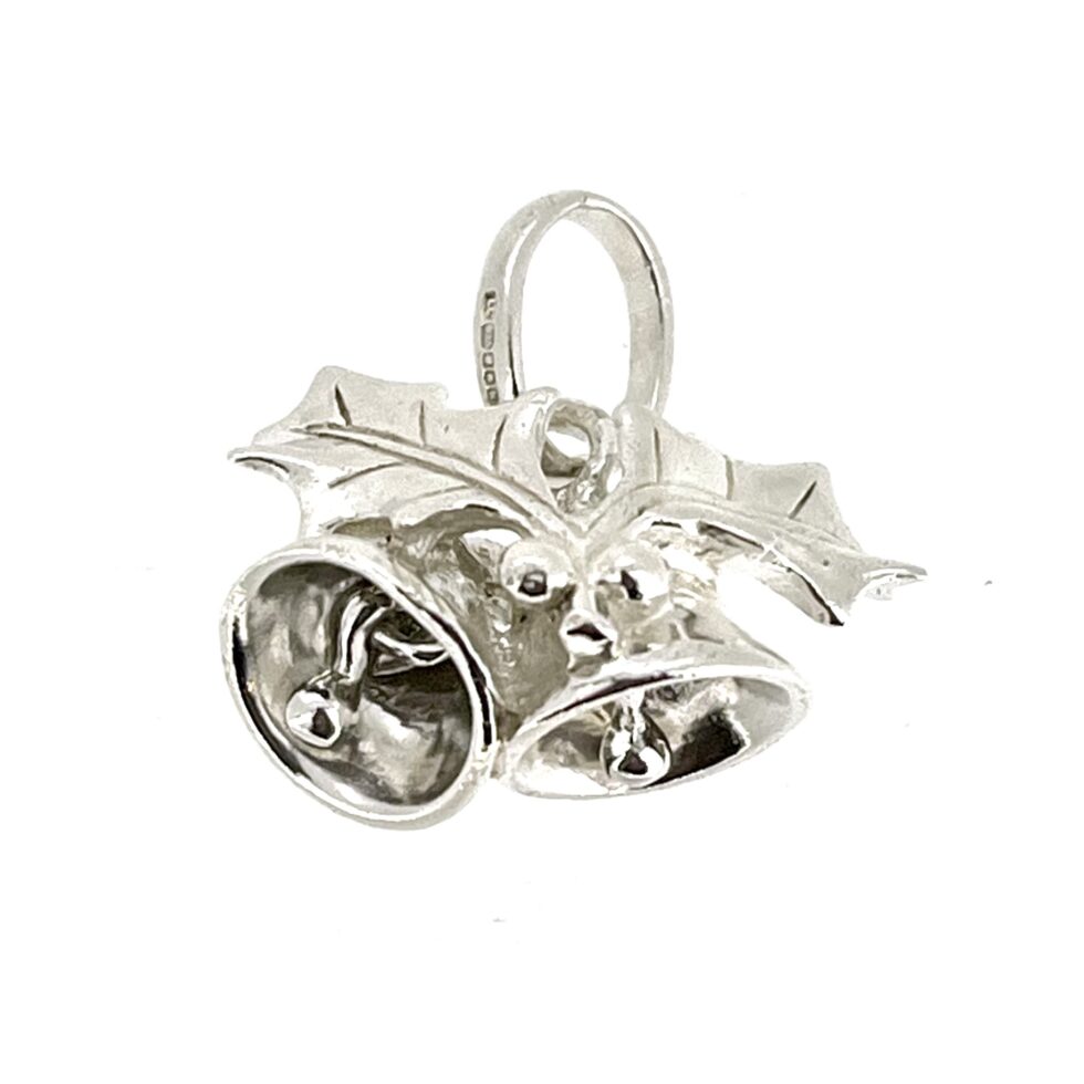 Front view of the charm highlighting its intricate holly and berry detailing.