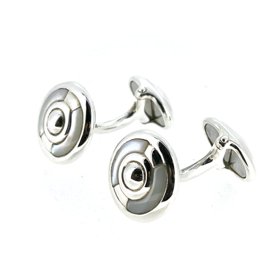 Close-up of the polished sterling silver finish and mother of pearl inlays.