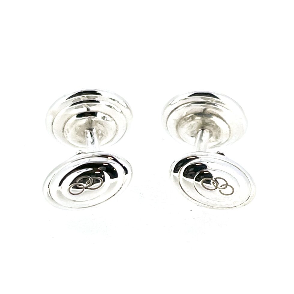 Close-up of the engraved Links of London logo on the swivel backs.