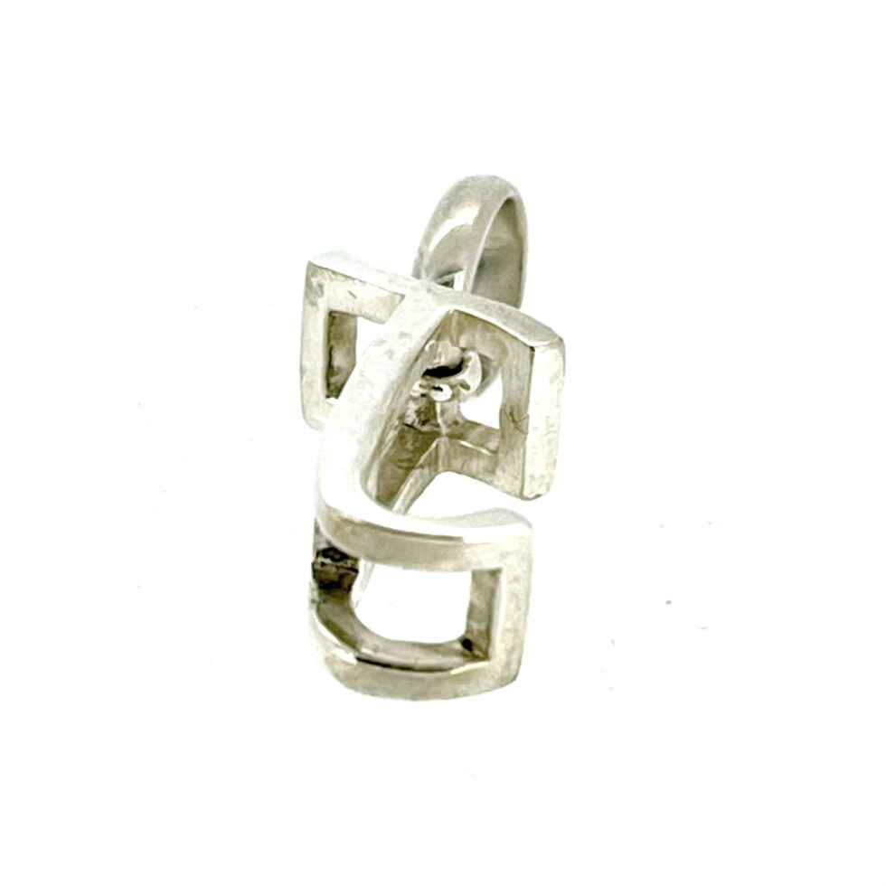 Angled shot highlighting the polished sterling silver finish.